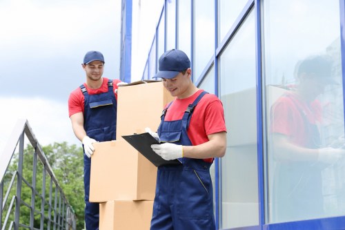 Man and van moving boxes in Maze Hill near local homes