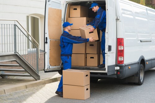 Movers planning a safe house move with protective equipment