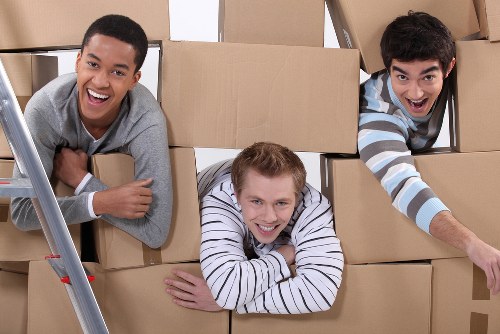 Moving team planning a removal job in Maze Hill near local residential buildings