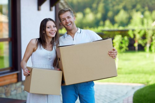 Unpacking boxes and arranging essentials in a new home after moving