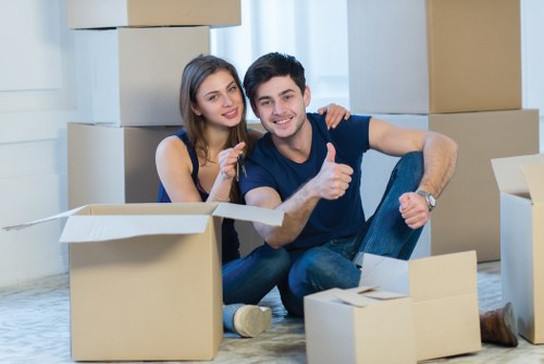 Local removals van moving boxes and household items near Maze Hill