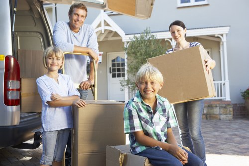 Packed boxes and furniture ready for removals in Maze Hill
