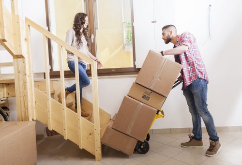 Van loading furniture for a residential move near Maze Hill