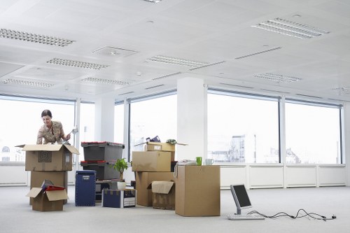 Packed moving boxes and furniture ready for local removals