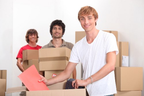 Local removal team preparing furniture for transport